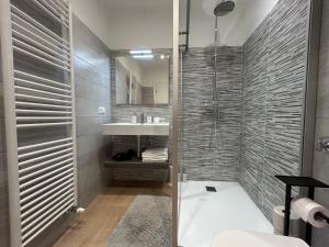 a bathroom with a shower and a sink at Rivacentro 4 in Riva del Garda