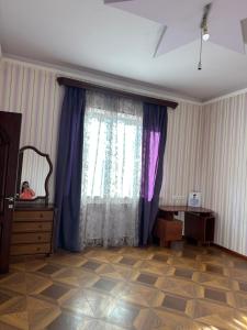 a room with a curtain and a dresser and a window at Dom in Aygavan +13 photos