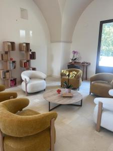 a living room with couches and a coffee table at Villa ArboreA in Squinzano