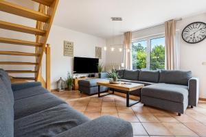a living room with a couch and a table at Haus 29 in Röbel