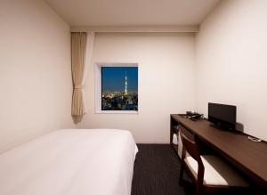 Postel nebo postele na pokoji v ubytování Hotel Crown Hills Ueno Premier