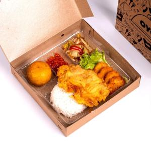 a box of food with rice and other foods at Hotel O Pekanbaru near Mall Ciputra Seraya formerly Lotus Inn in Pekanbaru