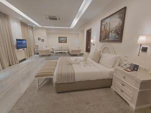 a hotel room with a large bed and a living room at The BellaVista Hotel Chandigarh Panchkula in Chandīgarh