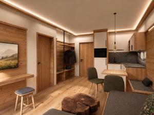 a living room with a table and chairs at Das Eppensteiner in Navis +44 photos