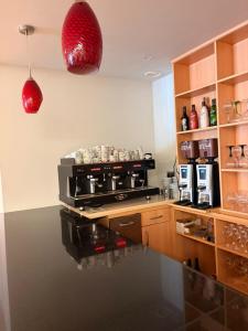 a kitchen with a stove and a counter top at Hotel del Vino in Cariñena