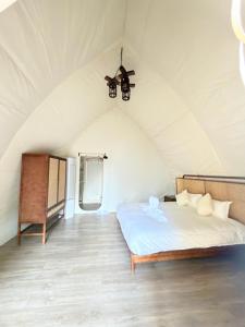 a bedroom with a bed in a tent at Umbrella tree เต้ทน์ in Nathon Bay