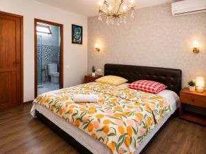 a bedroom with a large bed with two pillows at Guesthouse Vashlovani in Lagodekhi