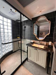 a bathroom with a shower and a sink and a mirror at Palais De Sapa Boutique Hotel in Sapa +41 photos