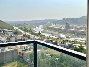 a view of a city from a balcony at 2BHK Apartment Perfect for Families & Groups in Rawalpindi