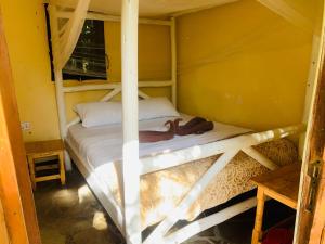 a bedroom with two bunk beds in a room at Essie Rovers Camp in Talek +2 photos