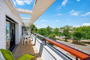 a balcony with a view of a street at Les 2 tours La Rochelle in La Rochelle
