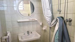 a bathroom with a sink and a mirror at Hotel Astoria in Riccione