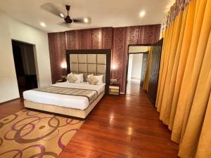 a bedroom with a bed in a room at Terrace Valley Hotel in Gangtok +38 photos
