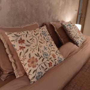 a bed with two pillows on top of it at Gîte Entre Semois et Forêt in Chiny