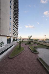 a brick walkway in front of a building at Jtower residences mandaue 12th flr in Mandaue City +3 photos