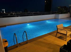 a swimming pool on top of a building at night at Jtower residences mandaue 12th flr in Mandaue City