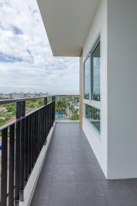 a balcony with a view of the city at Thongchen Residence in Samut Sakhon