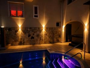 a swimming pool with purple lights in a house at Mijas Villa Doña Pilar Pool & Jacuzzi in Mijas