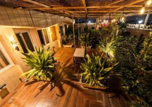 a room with a bunch of potted plants in it at Hotel Royal Palace in Chittaurgarh