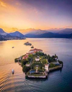 an island in the middle of a body of water at La Meridiana Apartment in Ghiffa