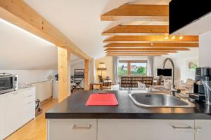 a kitchen with a sink and a counter top at Haus "Sonnenblume" in Regenstauf