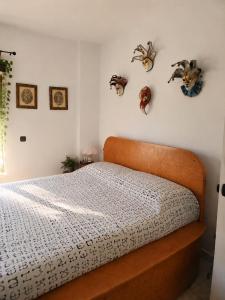 a bedroom with a bed with a wooden head board at Mijas Villa Doña Pilar Pool & Jacuzzi in Mijas +32 photos