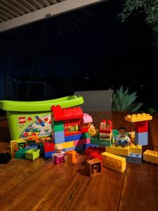 a group of lego toys on a wooden floor at Aloha Sands Scottburgh in Scottburgh