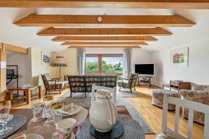a living room with a table and chairs at Haus "Sonnenblume" in Regenstauf