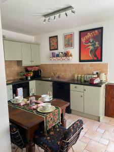 a kitchen with a table with plates on it at Dunboyne Apartment in Dunboyne