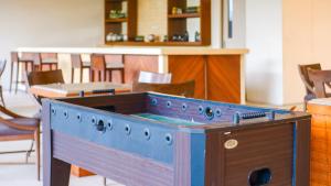a wooden stove in a room with a table and chairs at 2BR Fully Air-Conditioned Staycation with Parking in Manila