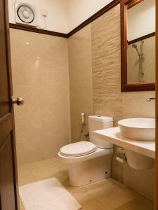 a bathroom with a toilet and a sink at Tarshish Villa - Colombo in Colombo +23 photos