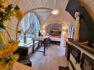 a bedroom with a bed and a table in a room at Igluhuts Passail in Passail