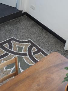 a floor with a mosaic tile floor in a room at B&B BnBeach in Varazze +20 photos