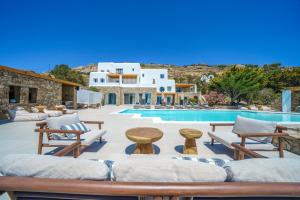 a villa with a swimming pool and a resort at Primadonna Luxury Villas in Mikonos