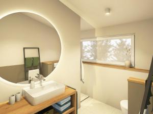 a bathroom with a sink and a mirror at Heidehaus in Lilienthal