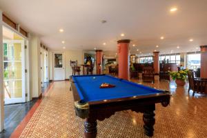a pool table in the middle of a room at Victoria Chau Doc Hotel in Chau Doc