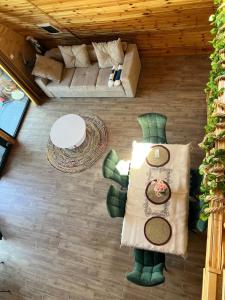 an overhead view of a living room with a couch at ValceleLakeRetreat in Merişani