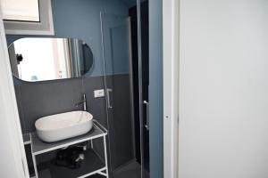 a bathroom with a sink and a mirror at Casa Marina in Balestrate +17 photos