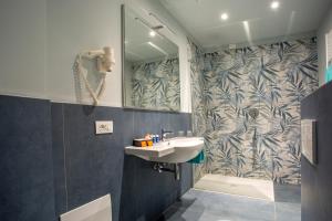 a bathroom with a sink and a shower at Europalace Hotel in Verbania