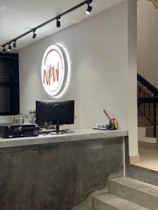 a lobby with a desk with a computer on it at USJ NPW New PinkWay Hotel in Subang Jaya