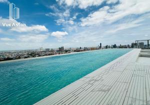 a infinity pool on the roof of a building at Vue Aston in Phnom Penh