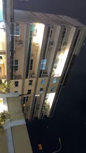 a view of a tall building with lights on at Étoile in Pointe-Noire