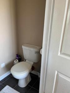 a bathroom with a white toilet in a room at Private double room at Caroline's Guest House, River Street, Clara in Tara