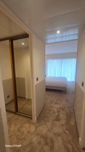a bedroom with a bed and a large mirror at Residence Club Inn in Nice +30 photos
