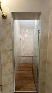 a shower with a glass door in a bathroom at BODRUM BURCU RESIDENCE, Magnificent Sea View, Cozy, Free Otopark, Free Wifi in Bodrum City +35 photos