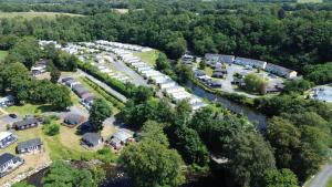 an aerial view of a parking lot with cars at Waters Edge Lodge in Caeathro
