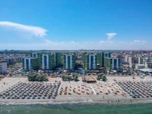 an aerial view of a beach with chairs and umbrellas at Alezi Apartamente in Mamaia Sat/Năvodari