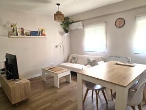 a living room with a couch and a table at Martita Home in Zaragoza