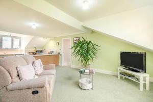 a living room with a couch and a tv at 1 Bed in Raithby oc-h42745 in Raithby