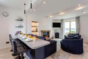 a living room with a large table and couches at 2 Bed in Thurso oc-n41742 in Thurso